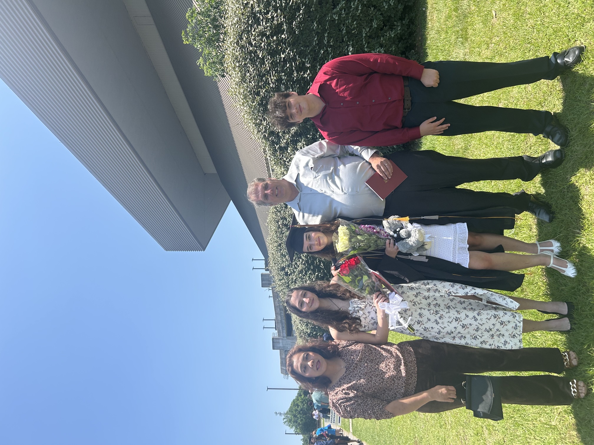 Allen Lottinger with his family at a graduation ceremony